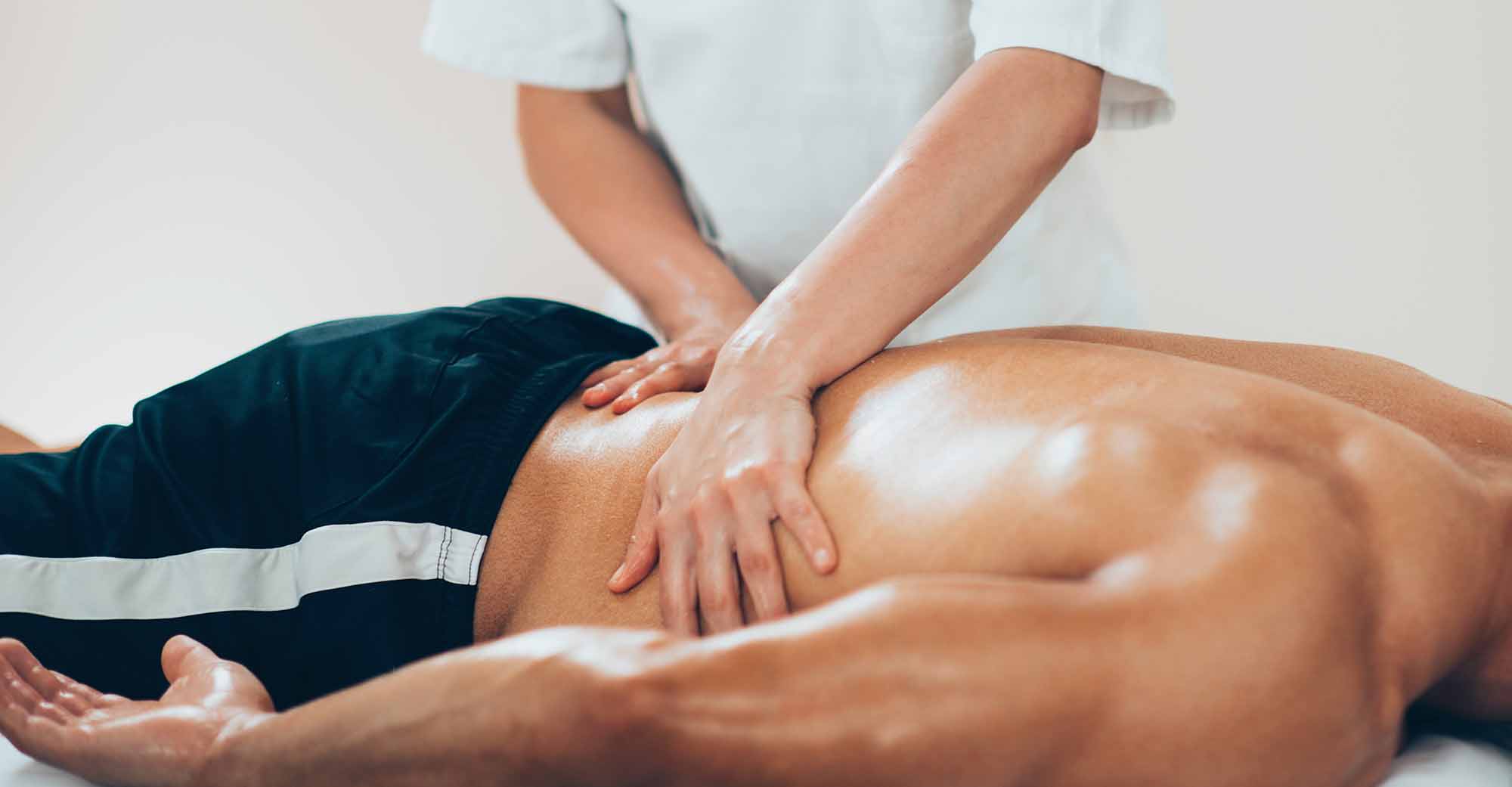 therapist working on back of patient